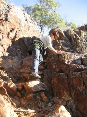 Liz climbing down the rocks at Belougery Split Rock